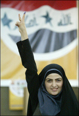 Iraqi voter flashing the V-sign